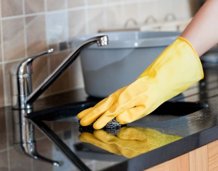 Professional carpets cleaner in Enfield deep cleaning a living room carpet