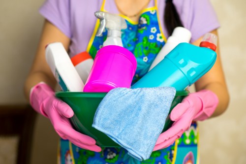 Professional cleaner in Enfield preparing a tidy kitchen