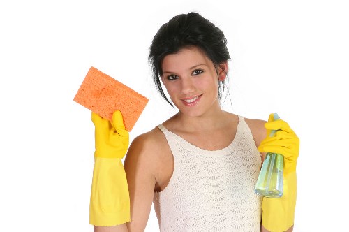 Professional carpet cleaner in Enfield deep cleaning a living room carpet