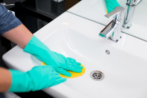 Domestic cleaning team in Enfield refreshing a family kitchen