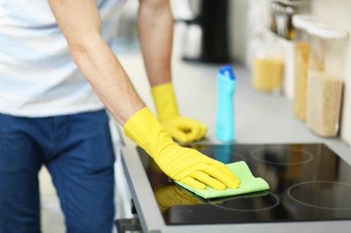 End of tenancy cleaner in Enfield cleaning floors and surfaces